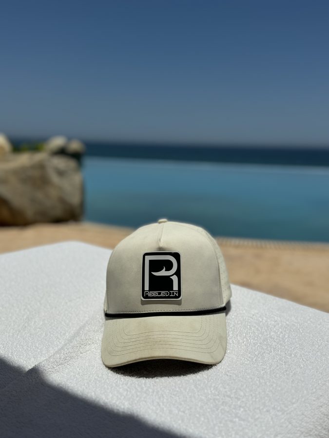 Reeled In hat by the water