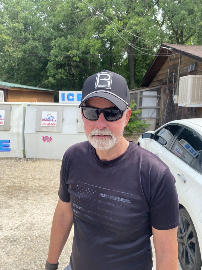 Customer at the launch wearing a Reeled In hat