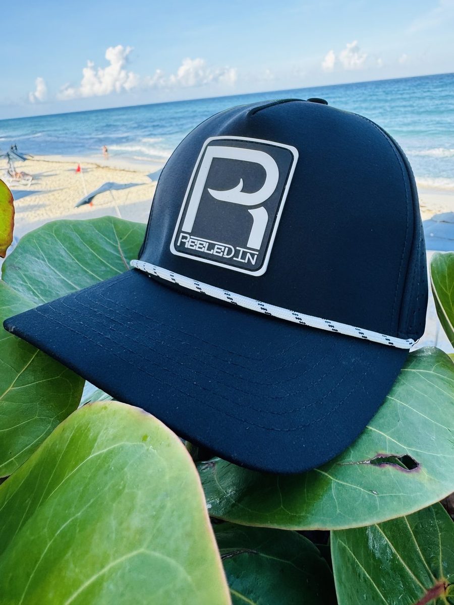 Reeled In rope hat against tropical greenery